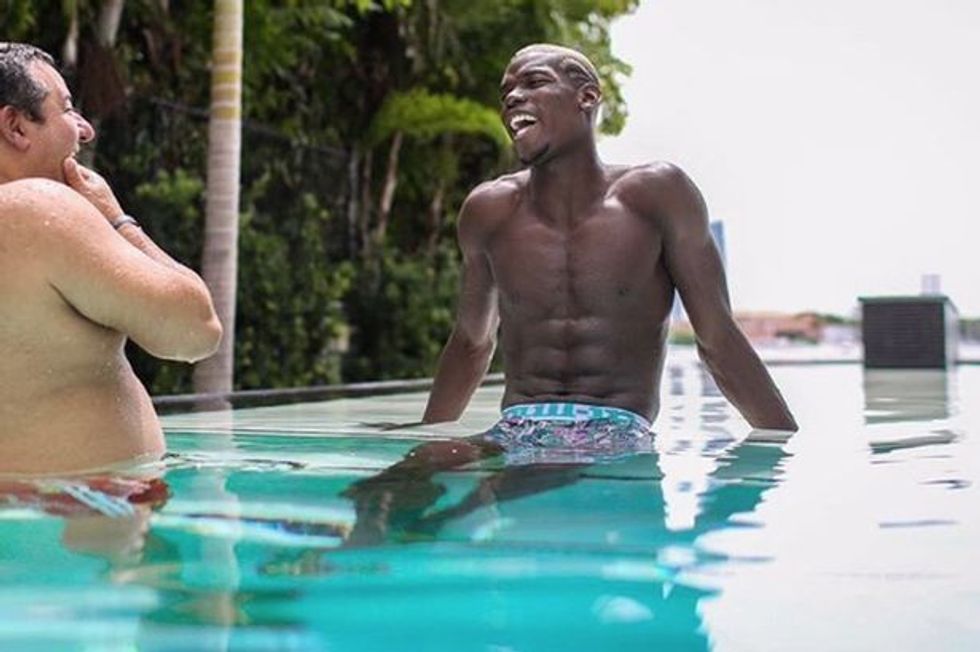 Paul Pogba poolside with manager Mino Raiola
