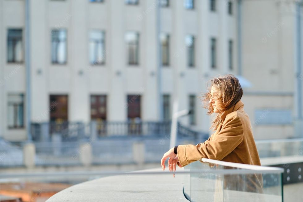 pensive young woman observation deck windy day 105609 8539