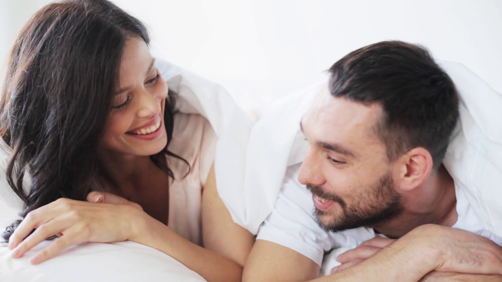 people rest love relationships and happiness concept happy couple lying in bed and having fun at hom 1