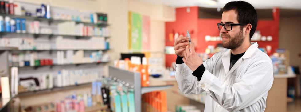 pharmacist holding needle horizontal e1385498335654