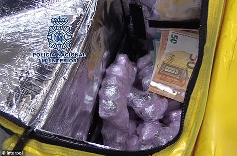 Photos of drugs and cash concealed within a food delivery bag, which was seized by the Spanish National Police in in Alicante and Valencia in Early April