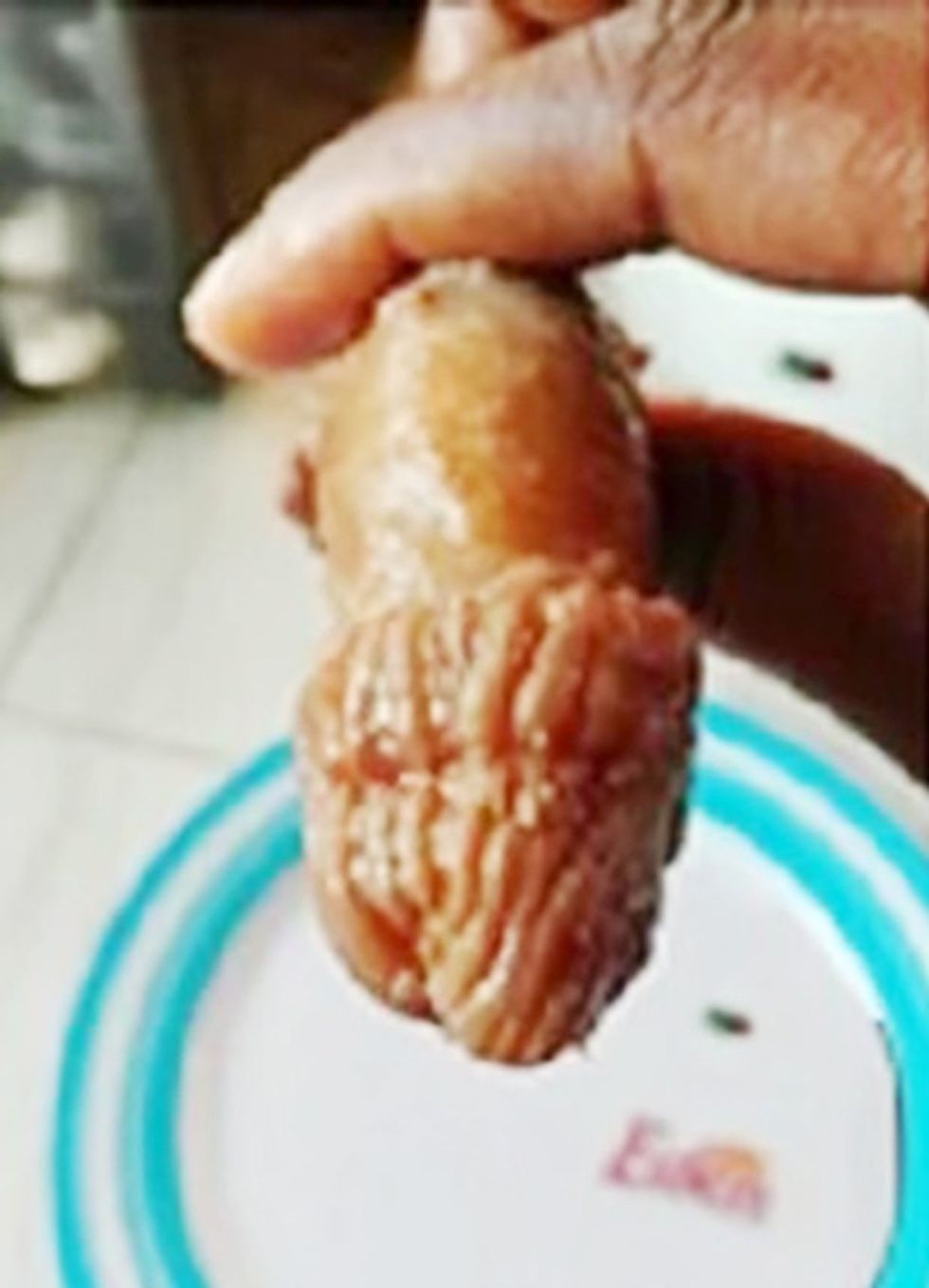 Pic shows: The served meat with the appearance of a male genital organ.nnAstonishing images of what looks like a human penis served up at a fast food bar have become a social media mystery.nnThe manhood-like dish had been unwittingly bought from a traditional chop house in Accra, Ghana by a customer named only as Akosua in local media.nnBut it was only when she got it home and started eating the dish - a local delicacy called Tuo Zafi ¿ that she realised she had bitten off more than she could chew.nnAkousa told local media: