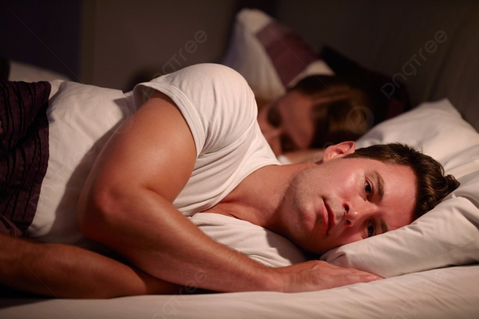 pngtree man lying awake in bed suffering with insomnia picture image 2035581