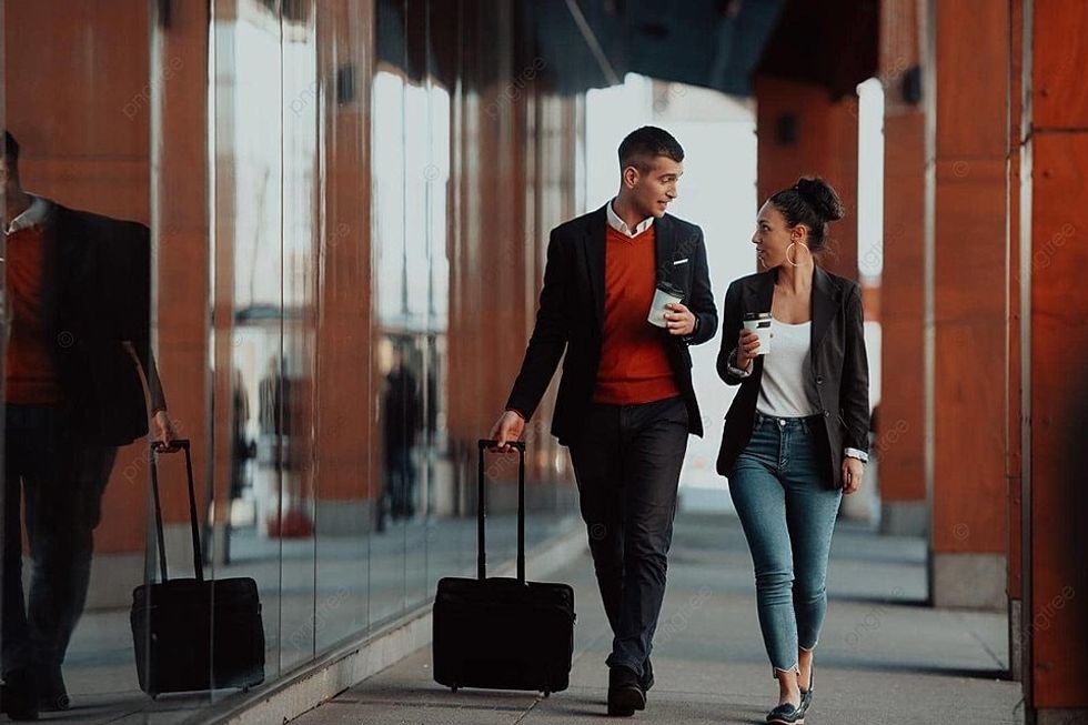 pngtree two businessmen walk aroun