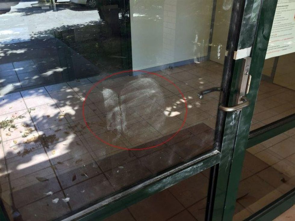 Police find 'bum print' at crime scene This hand out photo released by the Victoria Police on November 22, 2016 shows a bare buttocks print at a crime scene in the city of Wodonga. Australian detectives have been left with a cheeky clue after discovering that a large print on a glass door at a crime scene came from someone's bare buttocks. / AFP PHOTO / AFP PHOTO AND VICTORIA POLICE / STR / EDITORS NOTE ----RESTRICTED TO EDITORIAL USE MANDATORY CREDIT
