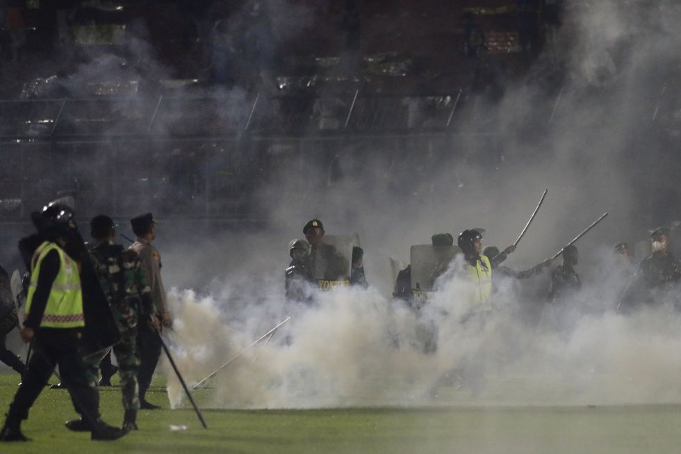 Police used tear gas , leading to tragic scenes at the Kanjuruhan Stadium
