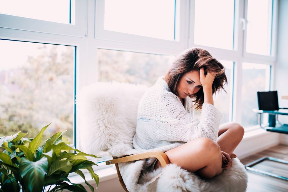 portrait sitting women girl home young flat apartment sad living brunette serious feeling stress t20 1JarJN