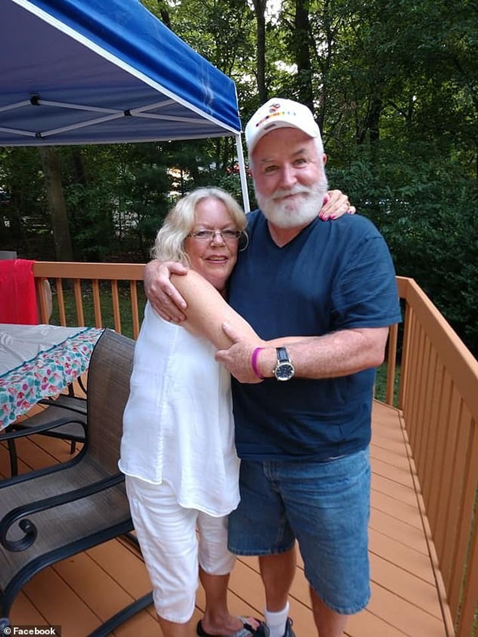 Powers (right) was allegedly stabbed to death by his son Thomas Scully-Powers, 32, say police. Powers is pictured with an unidentified woman from an image posted on Facebook