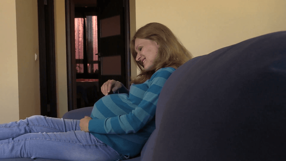 pregnant woman carefully touch her round belly stomach with love vy2yvgg4 F0000