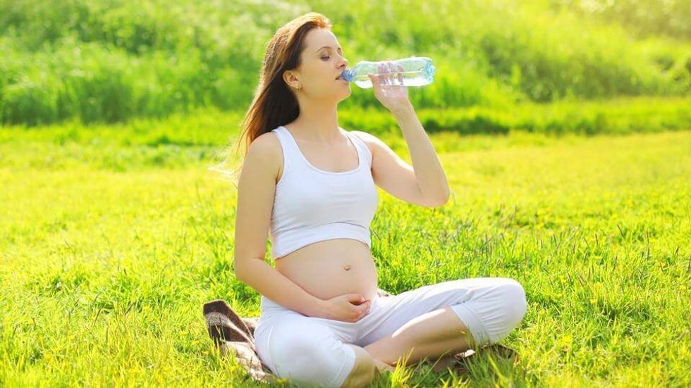 pregnant woman drinking water shutterstock plastic bottle eabef634 edaf 11e6 b62a 376882c41036