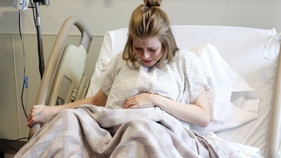 pregnant woman having contractions in hospital