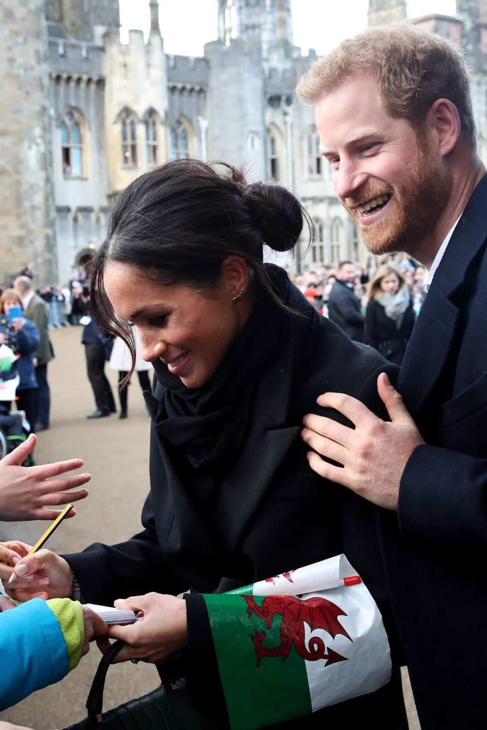 prince harry and his fiancee meghan markle sign autographs news photo 1586632153