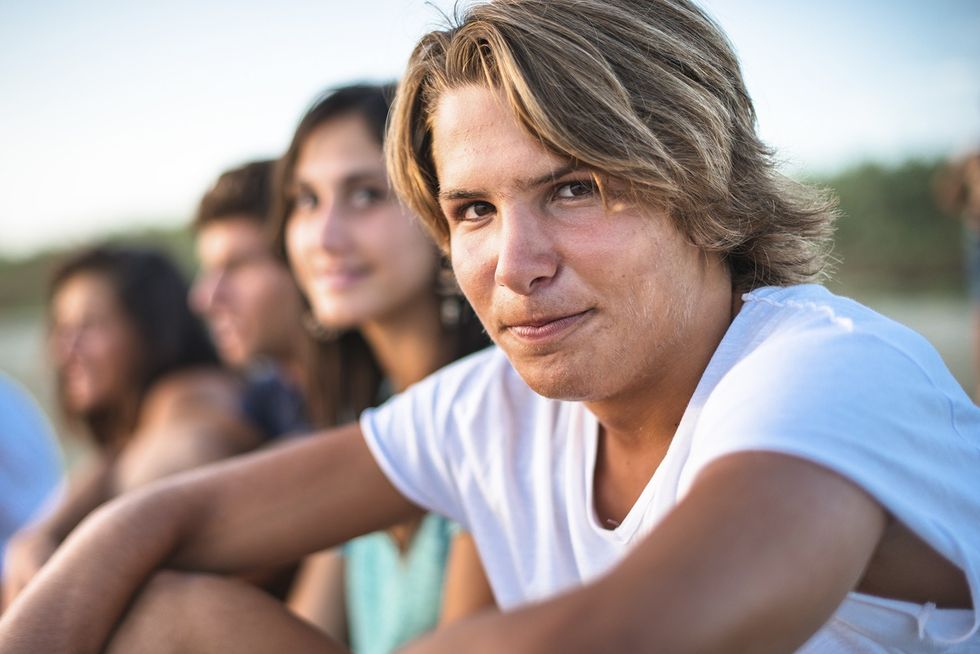Puberty teenagers friends at beach together iStock 511115656 web