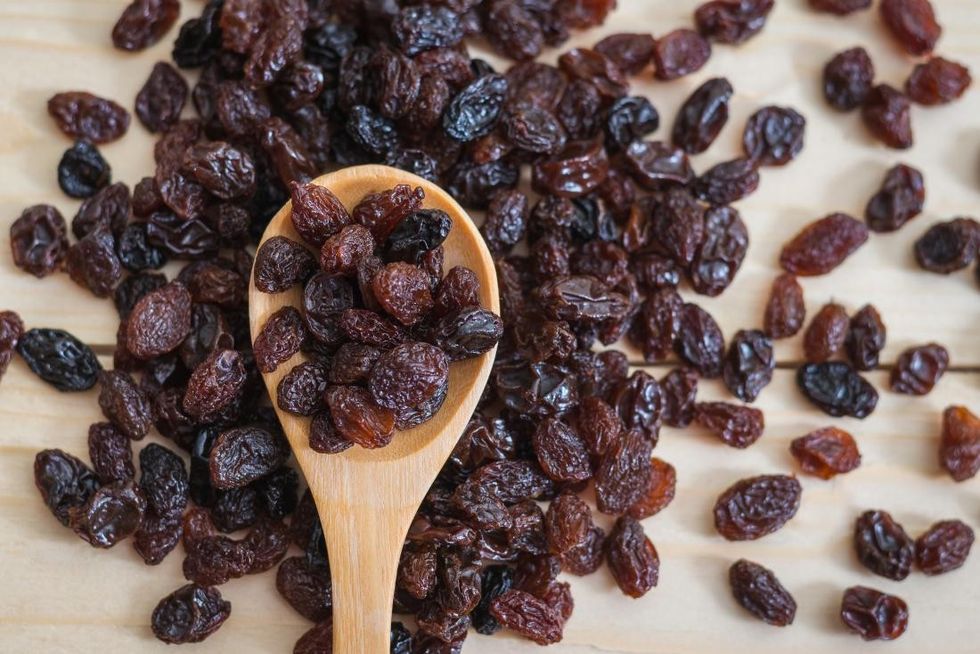 raisins on a wooden spoon