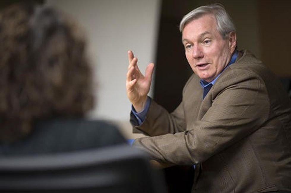 Regents Professor Michael Osterholm in animated conversation