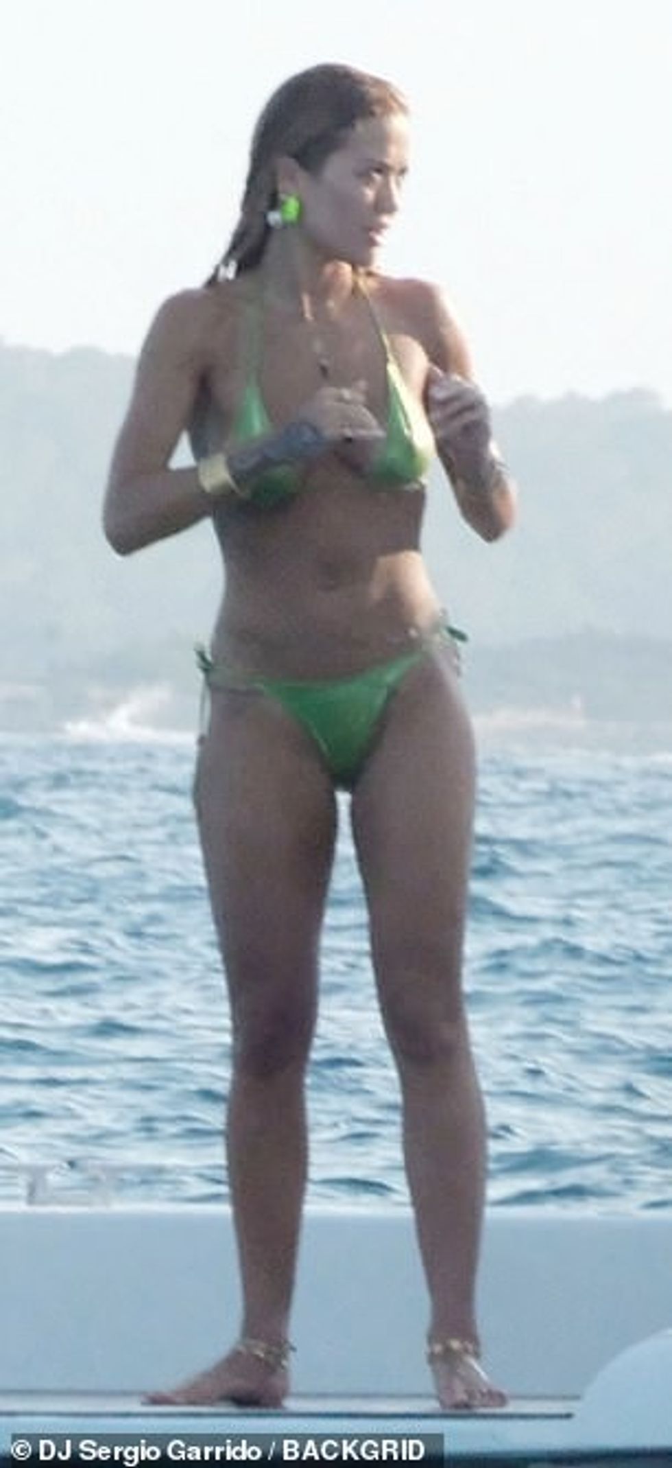 Rita showed off her amazing figure as she stood at the stern of the boat