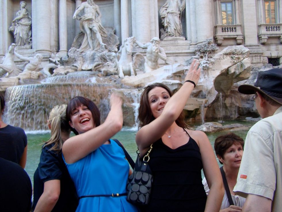 rome italy mom and jenna coins in trevi fountain