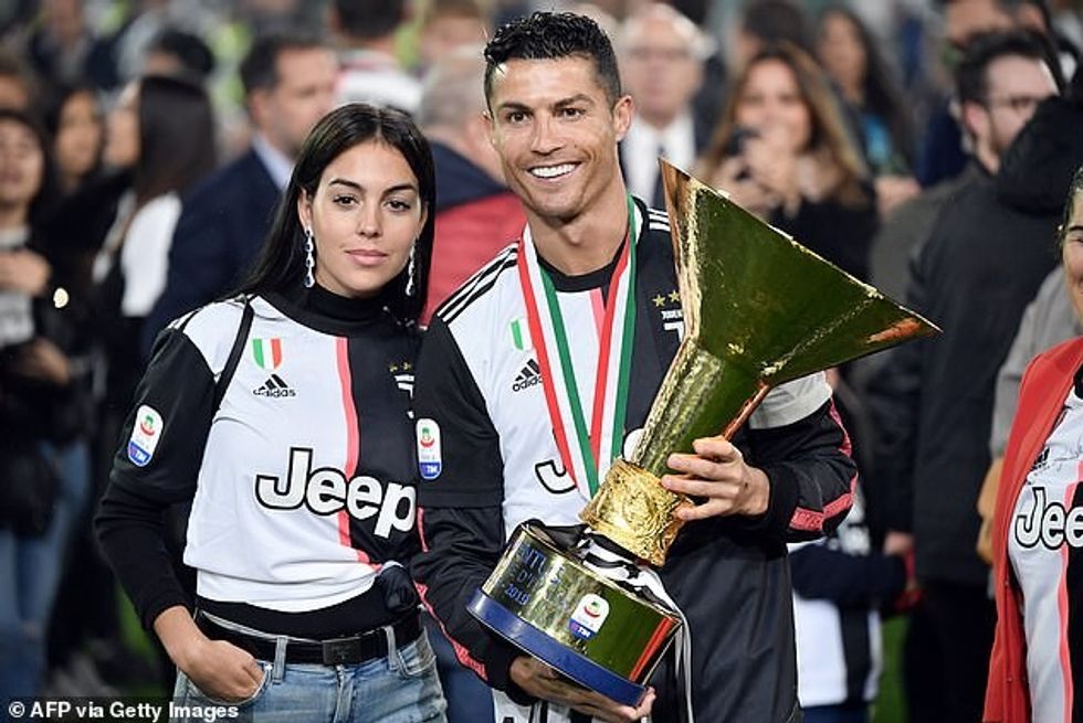 Ronaldo with partner Georgina and the Serie A trophy after Juventus won the league in 2019