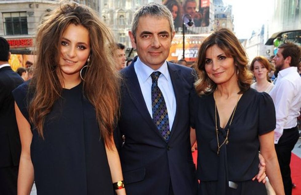 rowan atkinson attends johnny english rebord premiere with his daughter lily and wife sunetra sastry pic wire 259473537