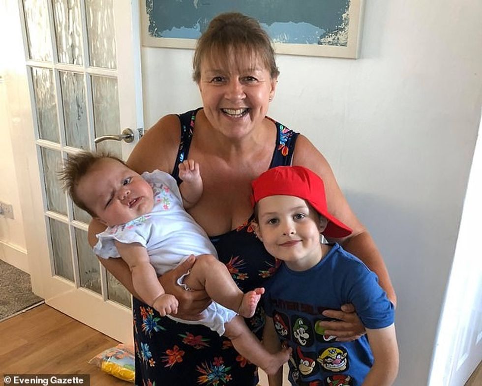 Sarah pictured with two of her grandchildren. She began self-isolating on April 2 and was rushed to James Cook University Hospital in Middlesbrough, North Yorkshire, two weeks later