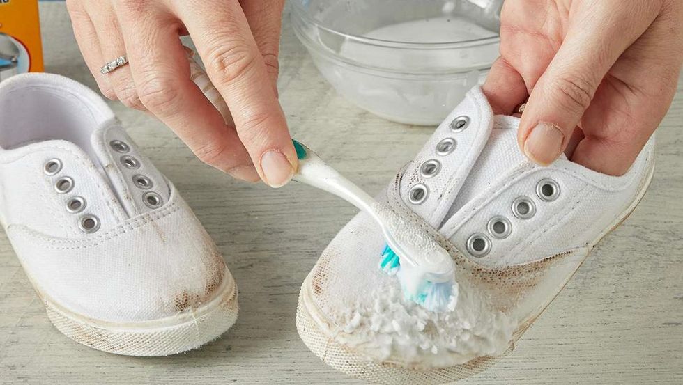 scrubbing shoe dirt toothbrush fa736043 e