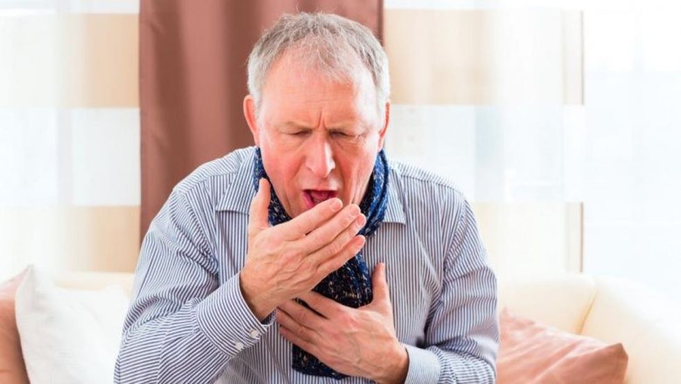 senior man coughing 1