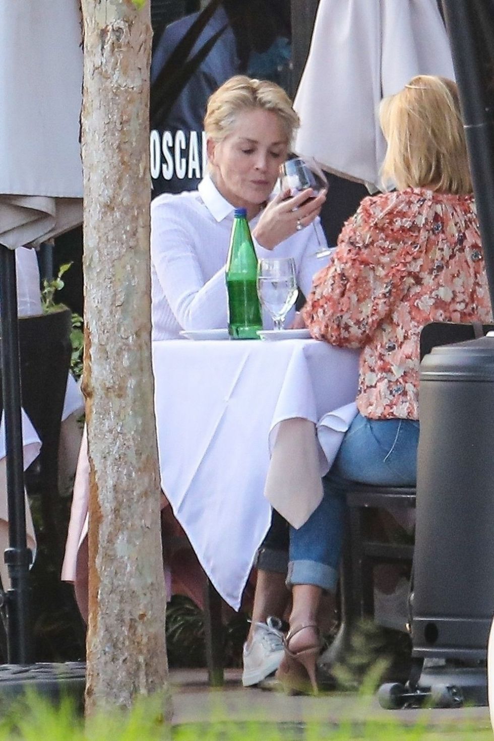 sharon stone in a pink blazer and matching pink purse at toscana restaurant in brentwood 08 12 2021 4