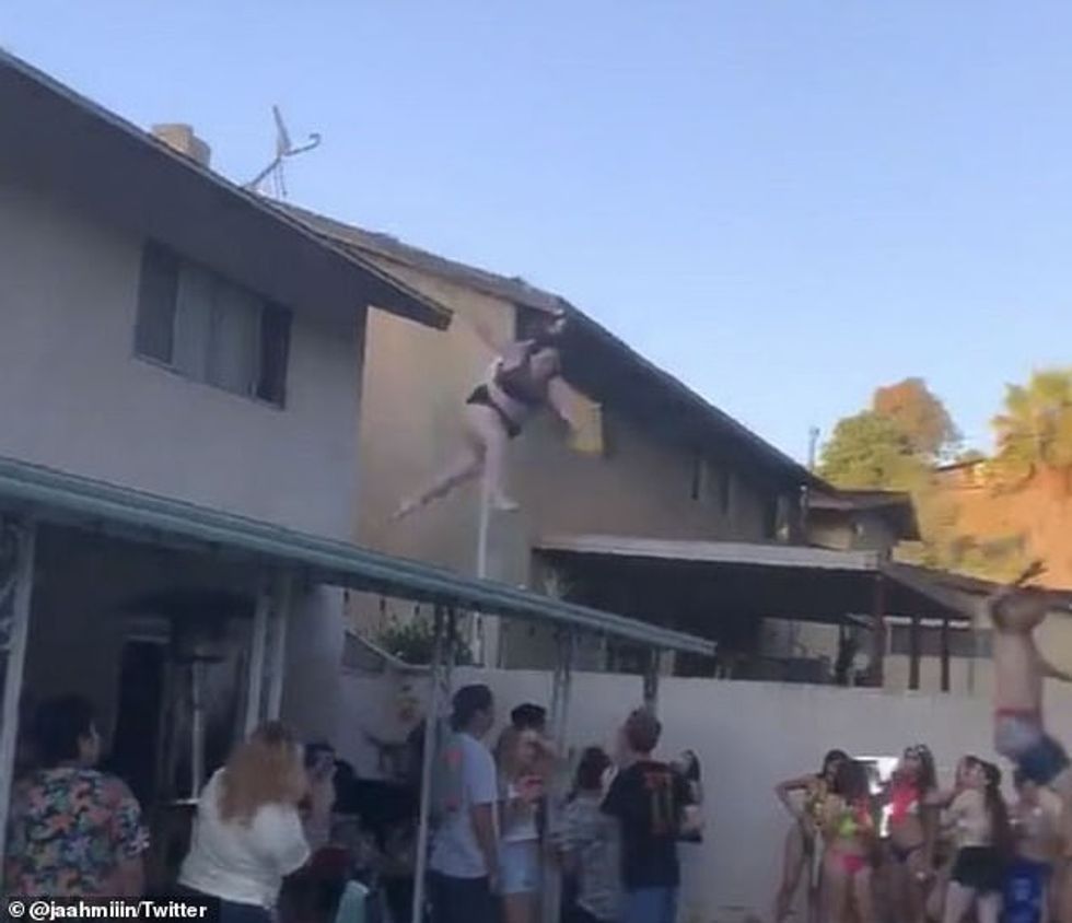 She ends up slamming into a shelter covering the patio underneath which people are drinking