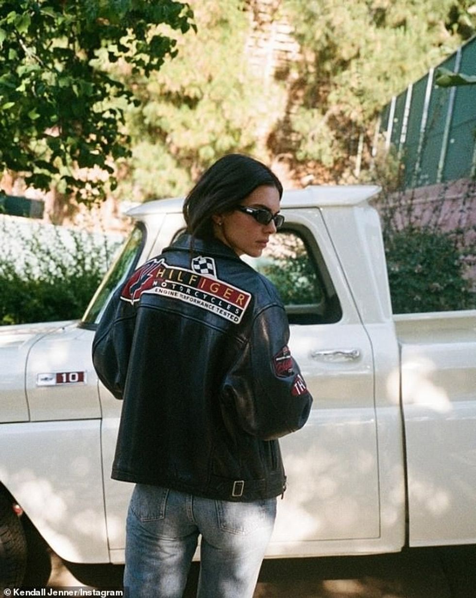 She left her dark brunette tresses down and sported rectangular, retro shades