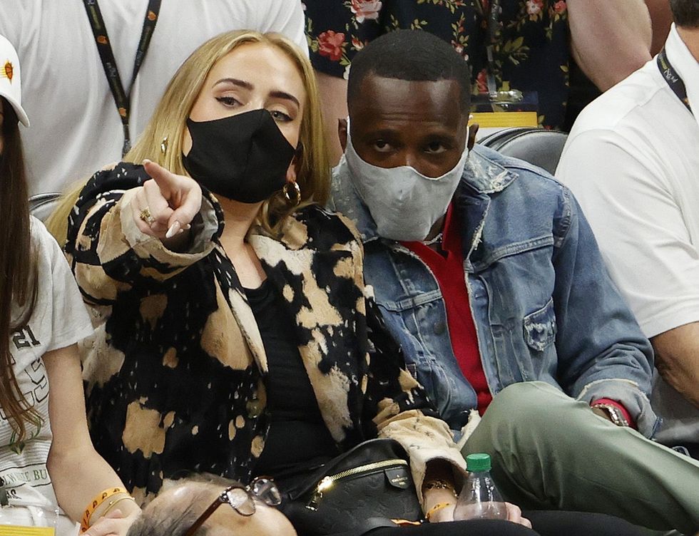 singer adele looks on next to rich paul during the first news photo 1633637300