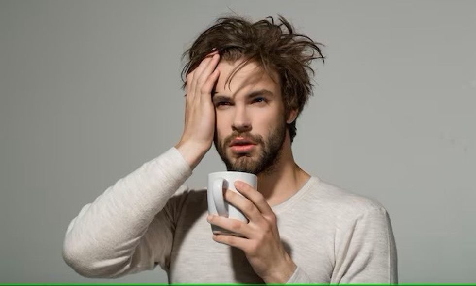 sleepy tired man with headach