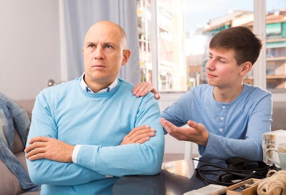 son apologizing to father teen boy trying apologize his irritated dispute 195883990