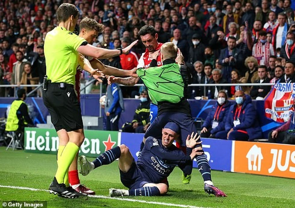 Stefan Savic started a mass brawl by dragging Manchester City's Phil Foden off the pitch