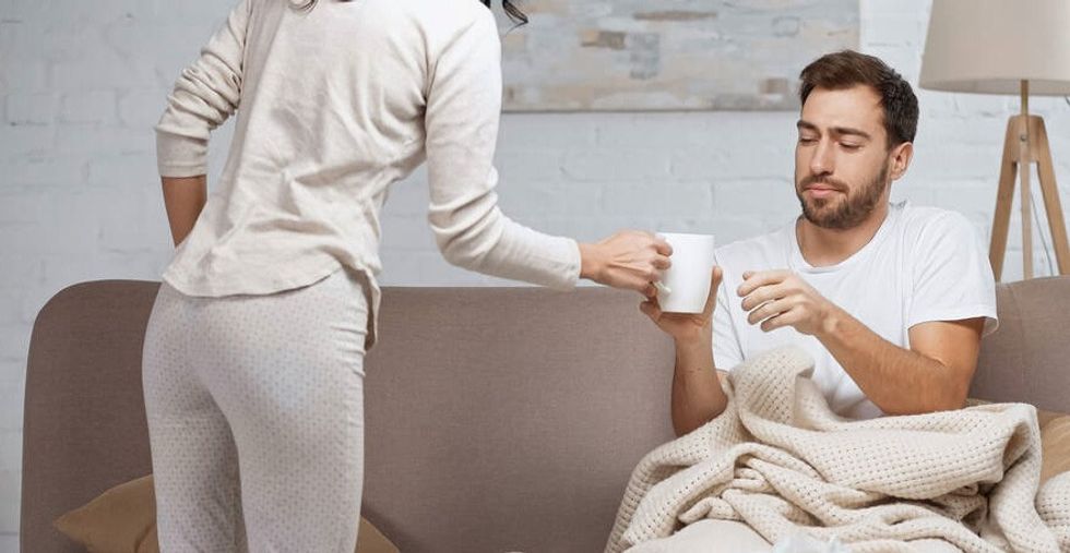 stock photo caring woman giving cup tea edited