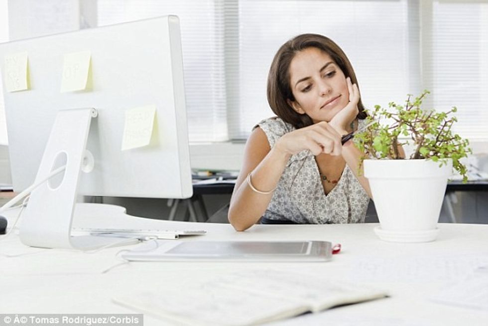 Stock photo unhealthy sitting at desk