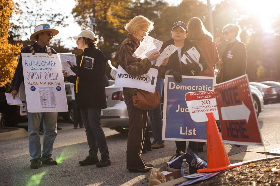 Supporters of Sen. Kay Hagan (D-N.C.) outside of a polling place in Asheville, N.C., Oct. 28, 2014. Democratic efforts to turn out the young and nonwhite voters who sat out the 2010 midterm elections appear to be paying off in several Senate battleground states, including North Carolina. (Mike Belleme/The New York Times)