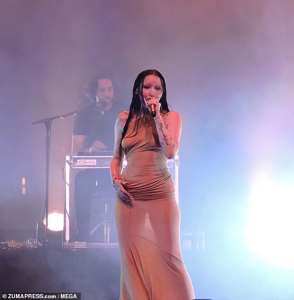 The 24-year-old singer sported a see through tan dress that showed off her chest as she went braless