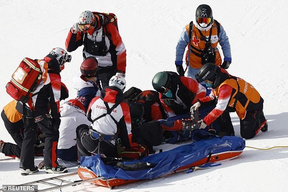 The 24-year-old was treated by at least four medics before being carried off on a stretcher