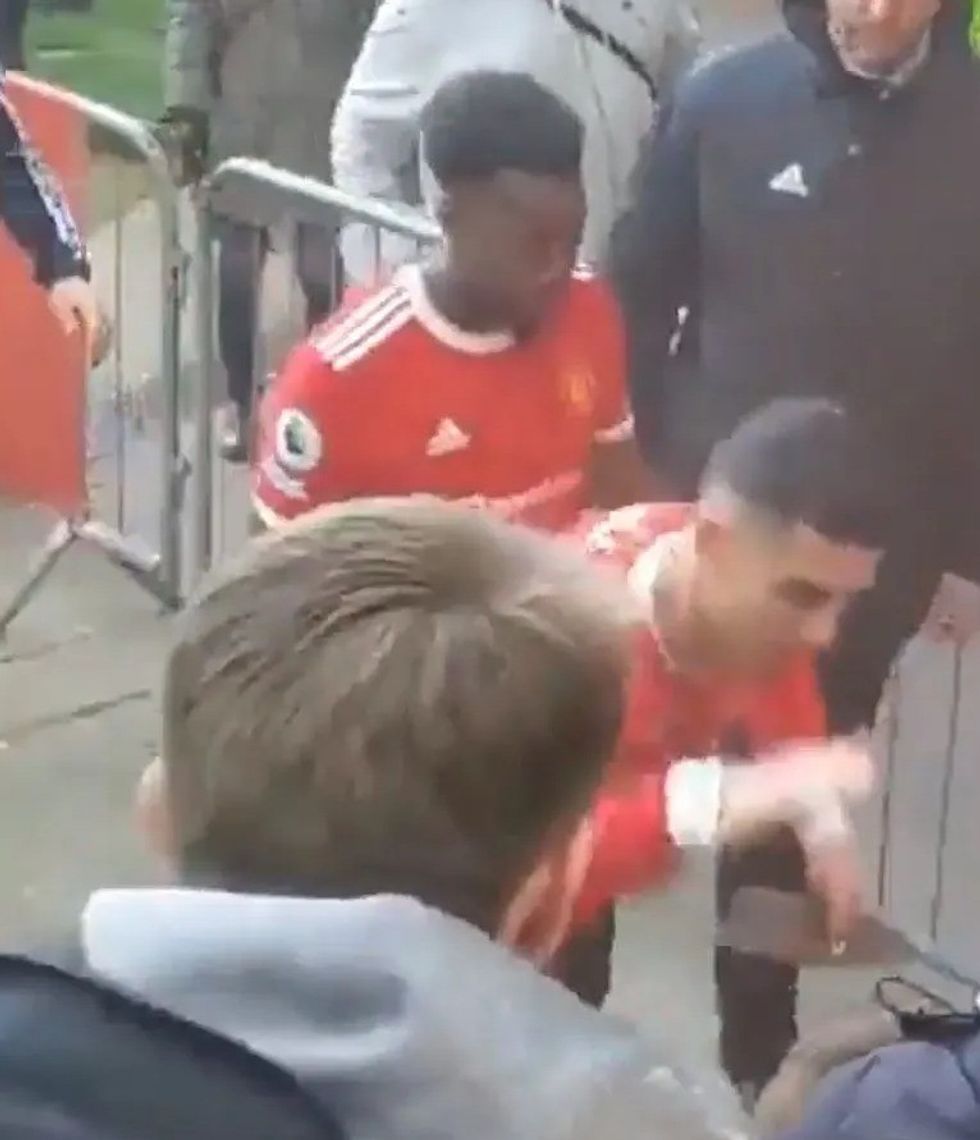 The ace has apologised after he was caught on camera appearing to knock 14-year-old Jacob's phone out of his hand