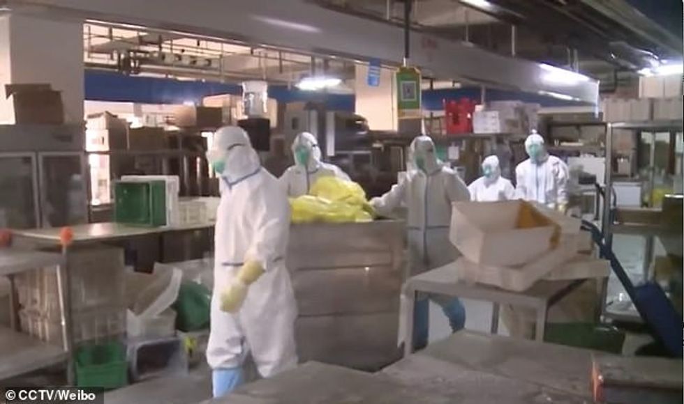 The inside of the closed trading hub, Xinfadi, has only been unveiled today in rare footage as hazmat-clad workers are seen disinfecting empty stalls and disposing of frozen meat