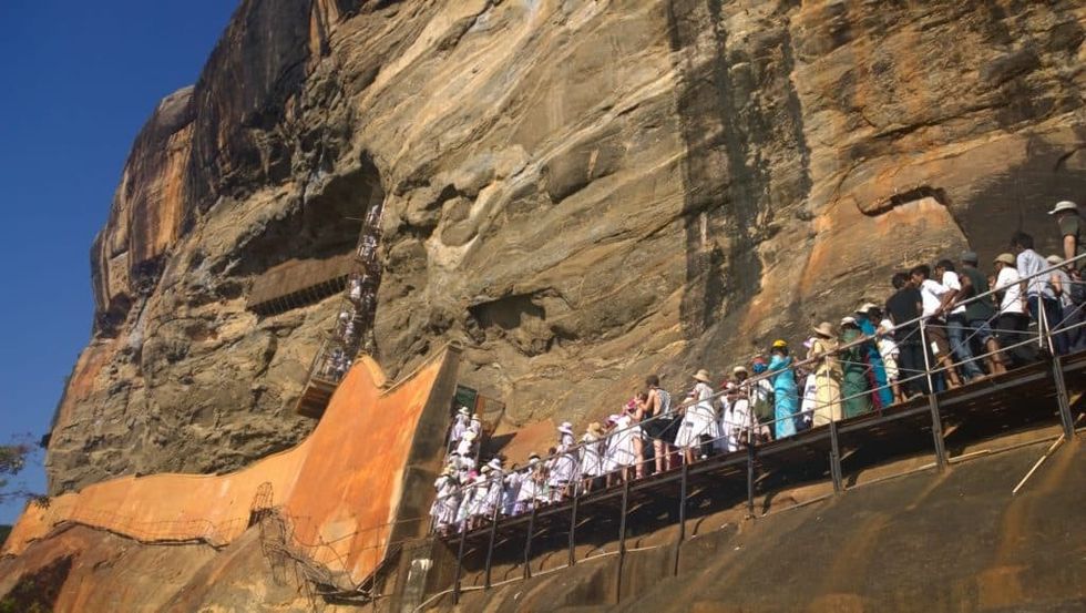 The mirror wall the spiral stairs and the crowd 1