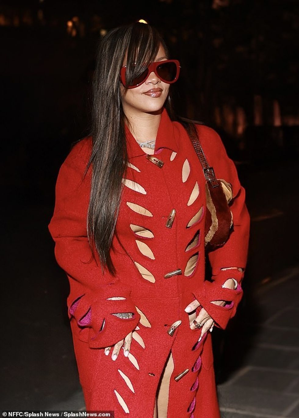 The multi-Grammy Award-winner, 36, slide out of the backseat of a chauffeured SUV dressed in a sexy all-red look