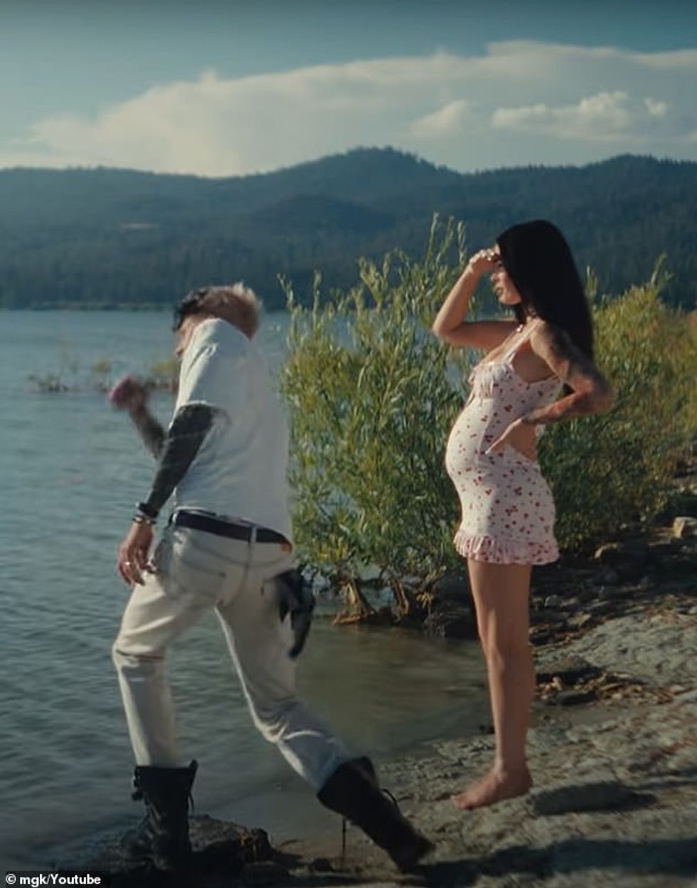 The pregnancy announcement comes several months after Megan and MGK confused fans with his music video, Lonely Roll, which was released in July; seen in a still from the video