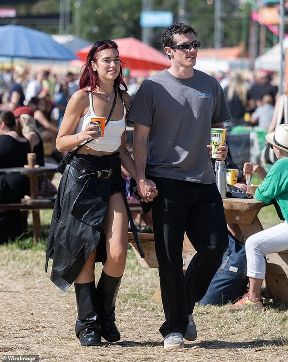 The singer toasted her headline success with her actor boyfriend Callum Turner, 34, in an exclusive bar at the Worthy Farm festival site