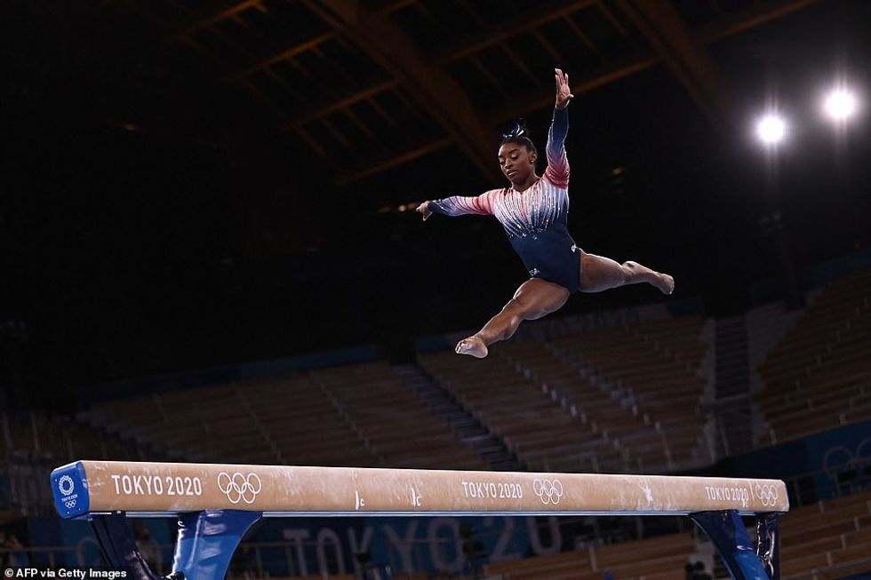 The six-time Olympic medalist was all smiles after she finished her sensational routine which earned her a score of 14.0, placing her in second place at the moment