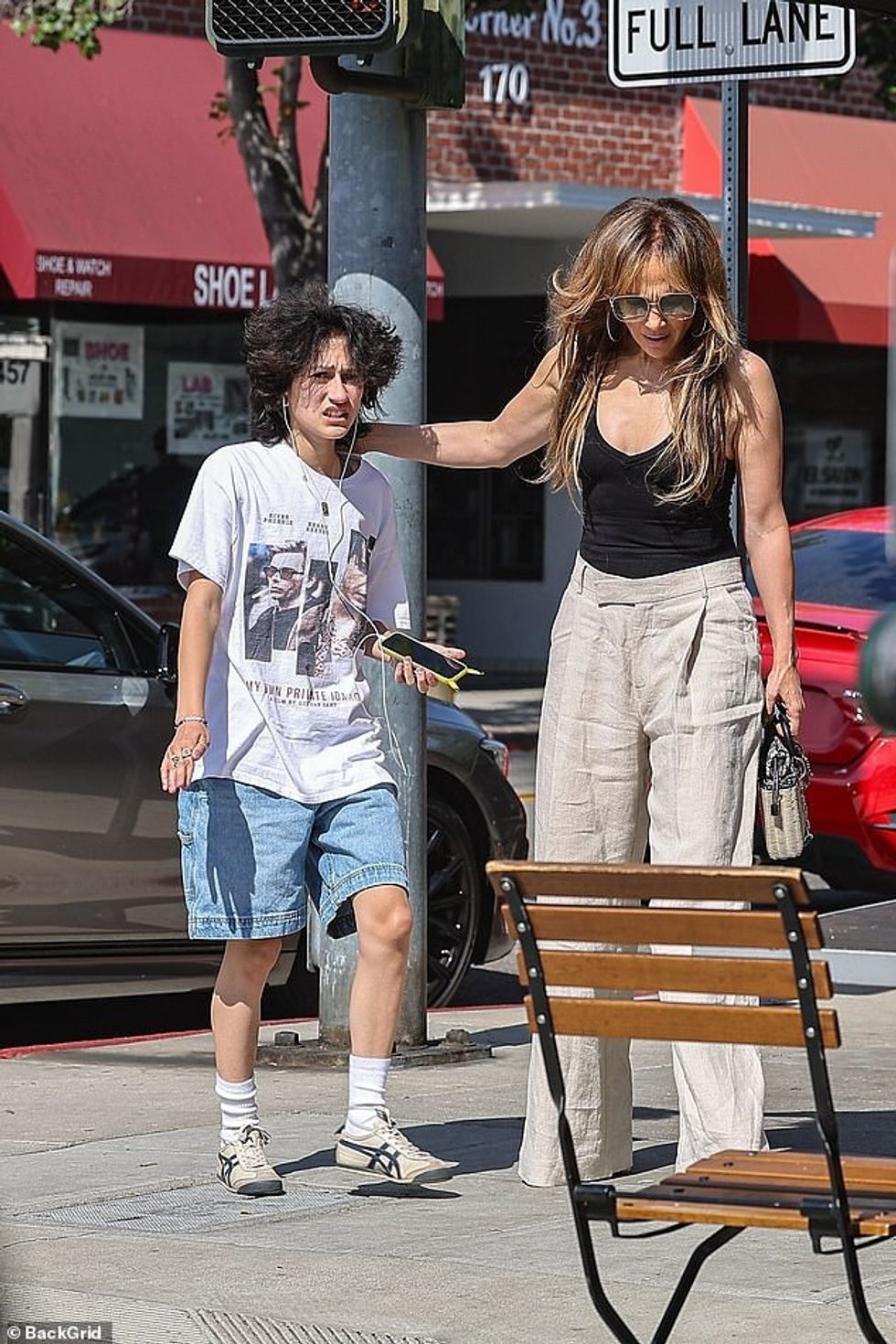 The star looked somber as she stepped out with Emme, 16, while clad in a plunging black top and high waisted cream trousers - after jetting back to LA from an extended stay in the Hamptons.