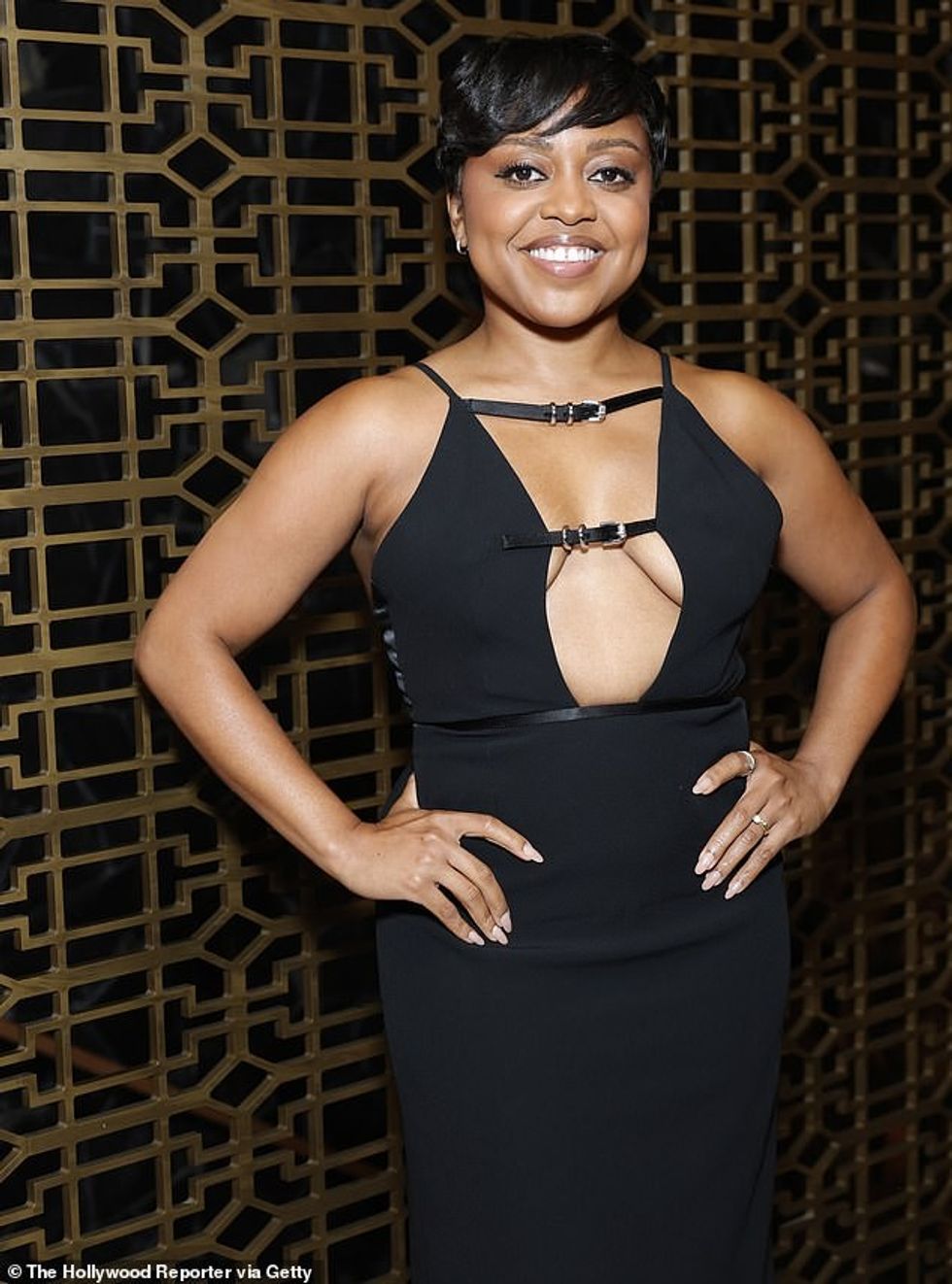 The star opted for minimal accessories to allow the dress to be the main focal point, and wore mini, silver-hooped earrings as well as a few silver rings