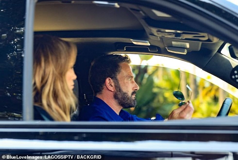 The star took off his aviators as they drove away