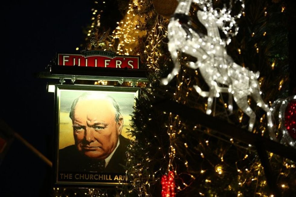 The stunning Churchill Arms pub in Kensington, London which is lit up with 85 Christmas trees, December 7 2016. The famous pub, near to Notting Hill Gate, has used flowers and plants all year round attract punters for nearly 30 years.