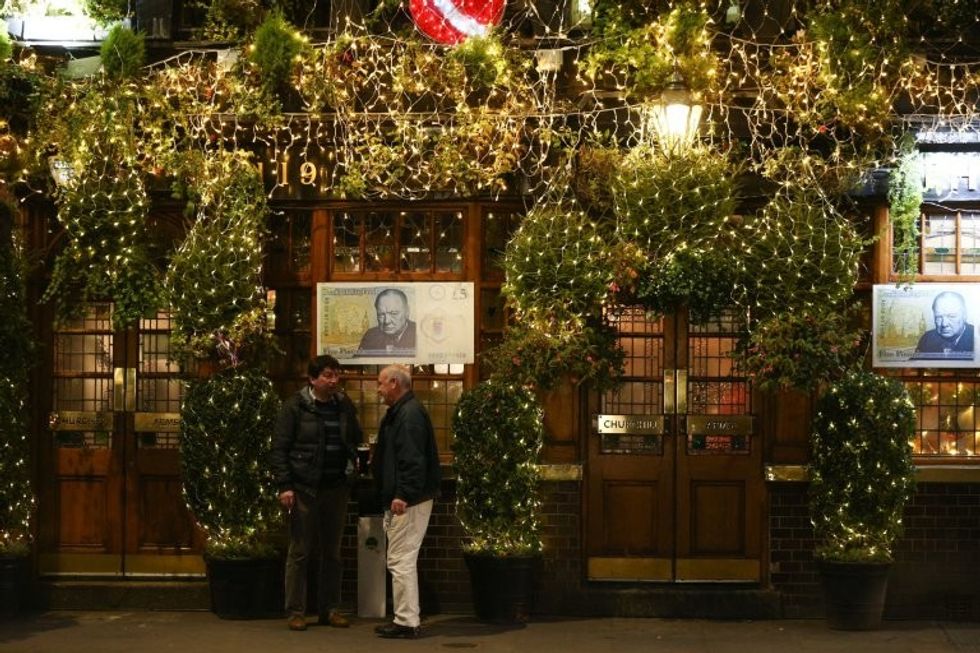 The stunning Churchill Arms pub in Kensington, London which is lit up with 85 Christmas trees, December 7 2016. The famous pub, near to Notting Hill Gate, has used flowers and plants all year round attract punters for nearly 30 years.